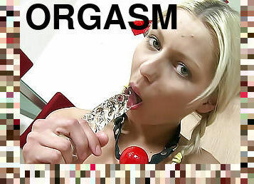 She brings herself to orgasms with a glass dildo