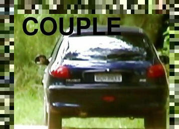 A horny young couple has sex in a car in the middle of