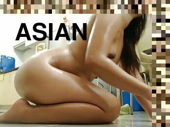 Asian trying to squirt on the floor