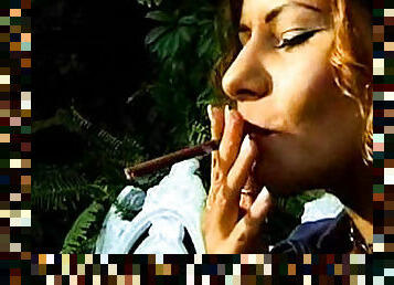 Sexy girl smokes in sheer top outdoors