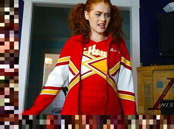 Redhead cheerleader girl has a dildo up he oily ass