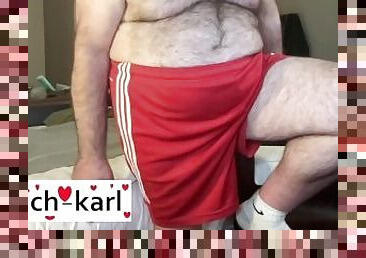 Coach Karl shows off his legs in his Orange gym shorts. 5