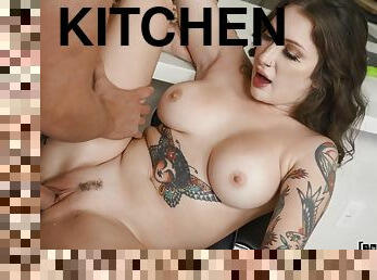 Inked brunette Bella Blu pleasures her man in the kitchen