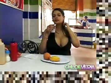 Latina with big tits eats a meal out