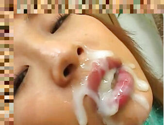 Asian schoolgirl being covered with sperm