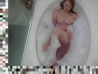 Solo redhead babe takes a bubble bath