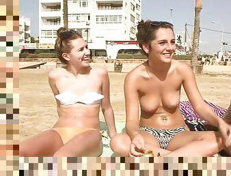 Topless beach chicks chat about their vacation