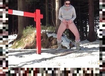 Busty sweater girl pees in the snow