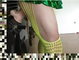 Crossdresser slut in yellow fishnet green miniskirt and black corsage opens her hole with big toys, nipple pumps, chastity