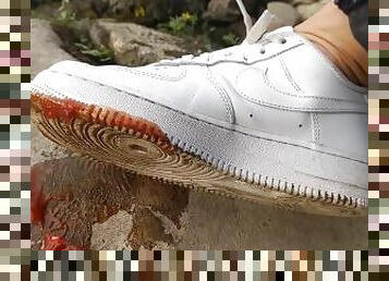 Boy crushes a ketchup packet with his new white sneakers Nike Air Force One AF1 sockless foot fetish