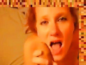 Amateur redhead is giving a sloppy blowjob