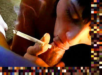 Smoking brunette enjoys warm oral