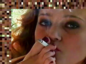 Smoking redhead posing her fine cunt