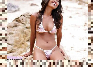 Exotic girl Putri Cinta shows her impeccable round tits on an empty beach.